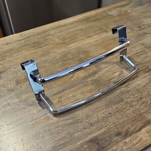 Over the kitchen cupboard door tea towel hanger